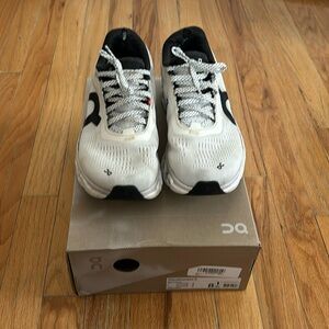 On Cloudmonster 2, Woman’s Size 8, White/Black color way.